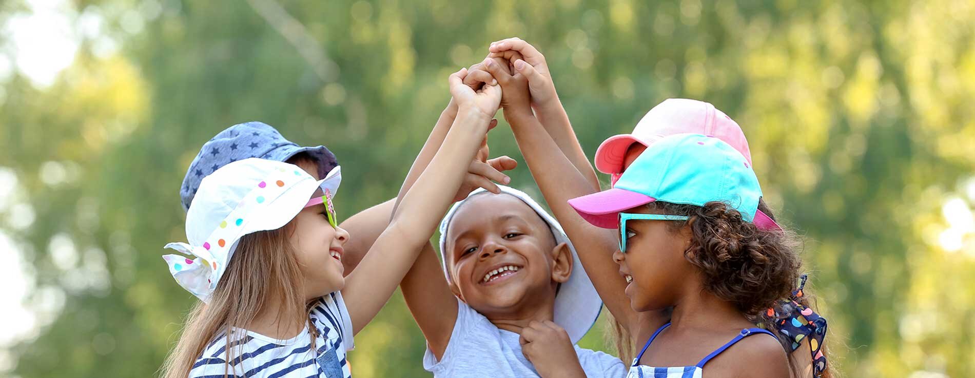 4 children high fiving